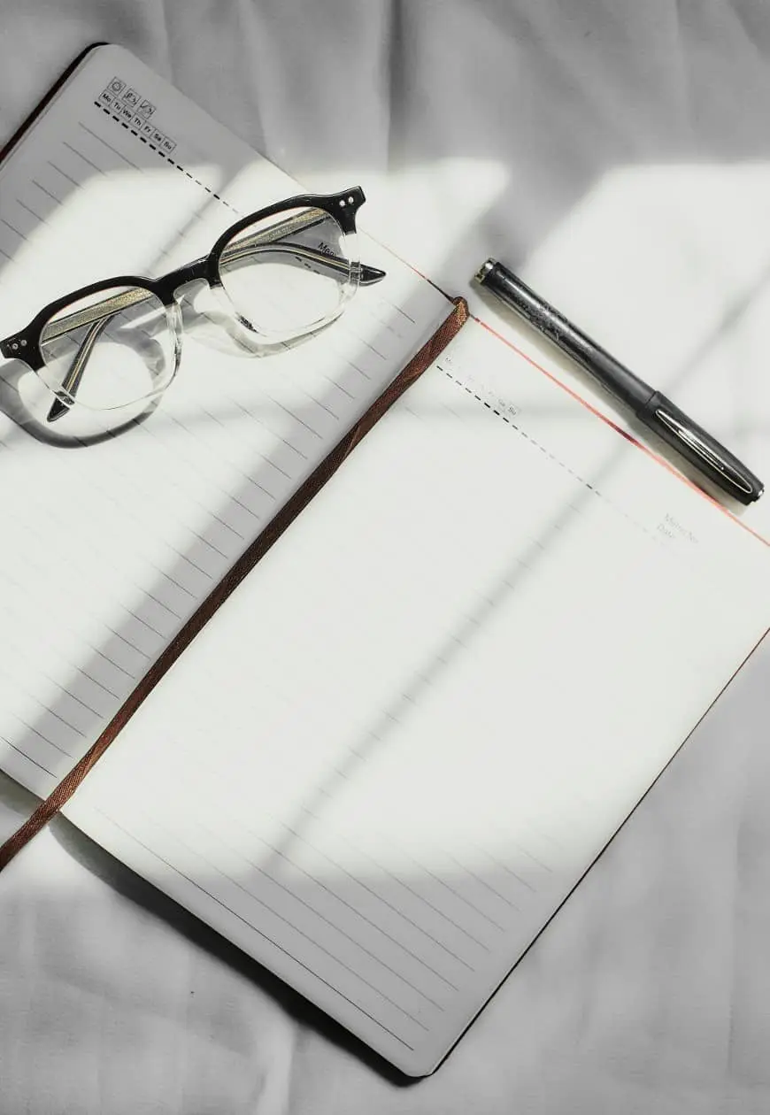 journal and glasses